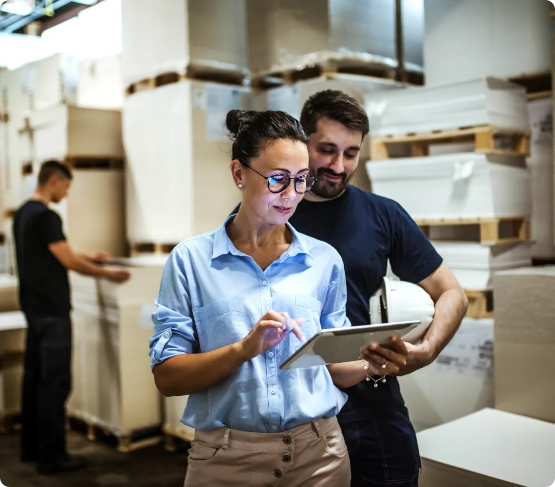 Two retail employee viewing on tablet